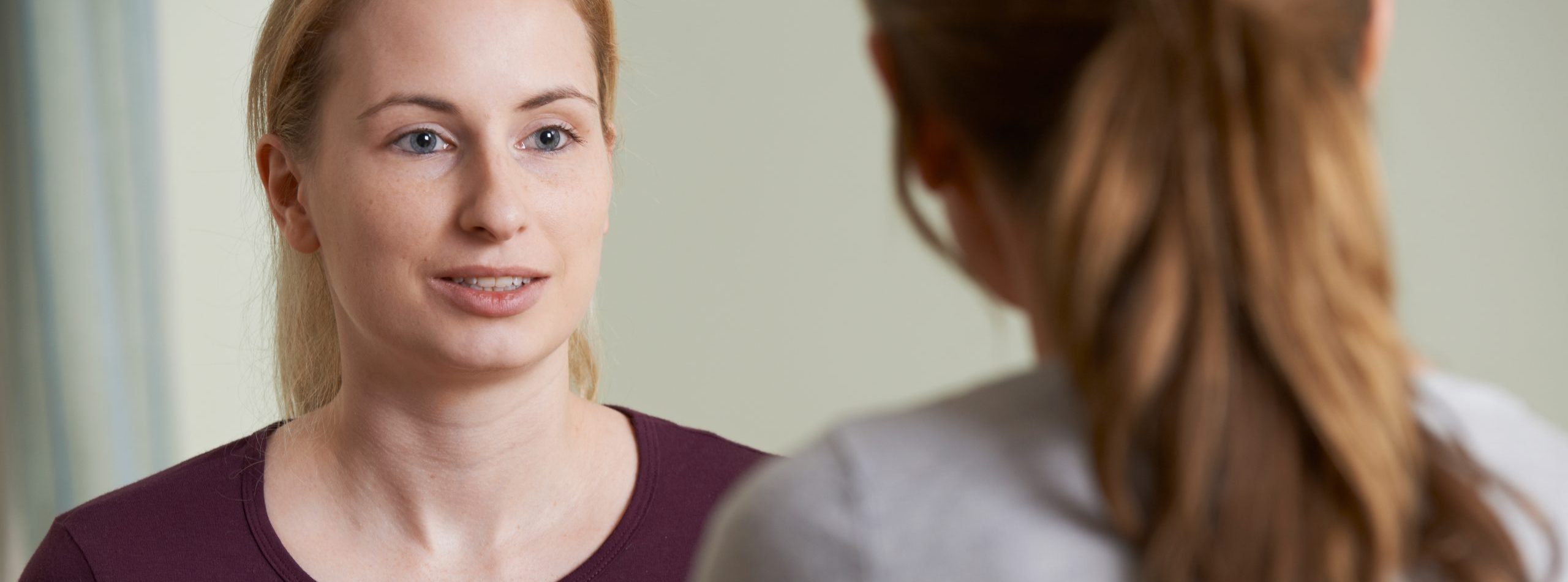 Young Woman Discussing Problems With Counselor